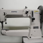 This heavy-duty, single-needle machine features a cylinder bed, compound needle feed, walking foot, and large shuttle hook for tackling thick materials and tubular items. Special harness feet allow for easy sewing near buckles and tight edges.