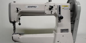 This heavy-duty, single-needle machine features a cylinder bed, compound needle feed, walking foot, and large shuttle hook for tackling thick materials and tubular items. Special harness feet allow for easy sewing near buckles and tight edges.